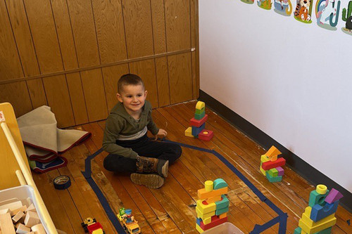 Child playing with trucks